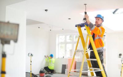 electrician installing downlights